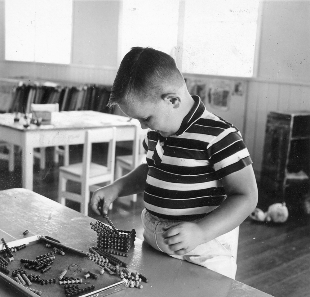Young child playing with construction set, Rosewood, Ipswich, c.1961