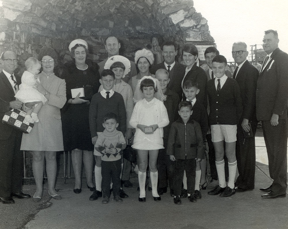 O'Dempsey family at first communion for a member of the family, at St Mary's Catholic Church, Ipswich, c.1969