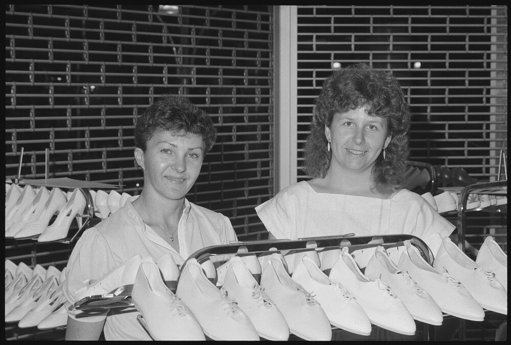 Unidentified women believed to be staff members at Redbank Plaza Shopping Centre Vic Jensens Family Shoe Store during the grand opening, Redbank, September 1985