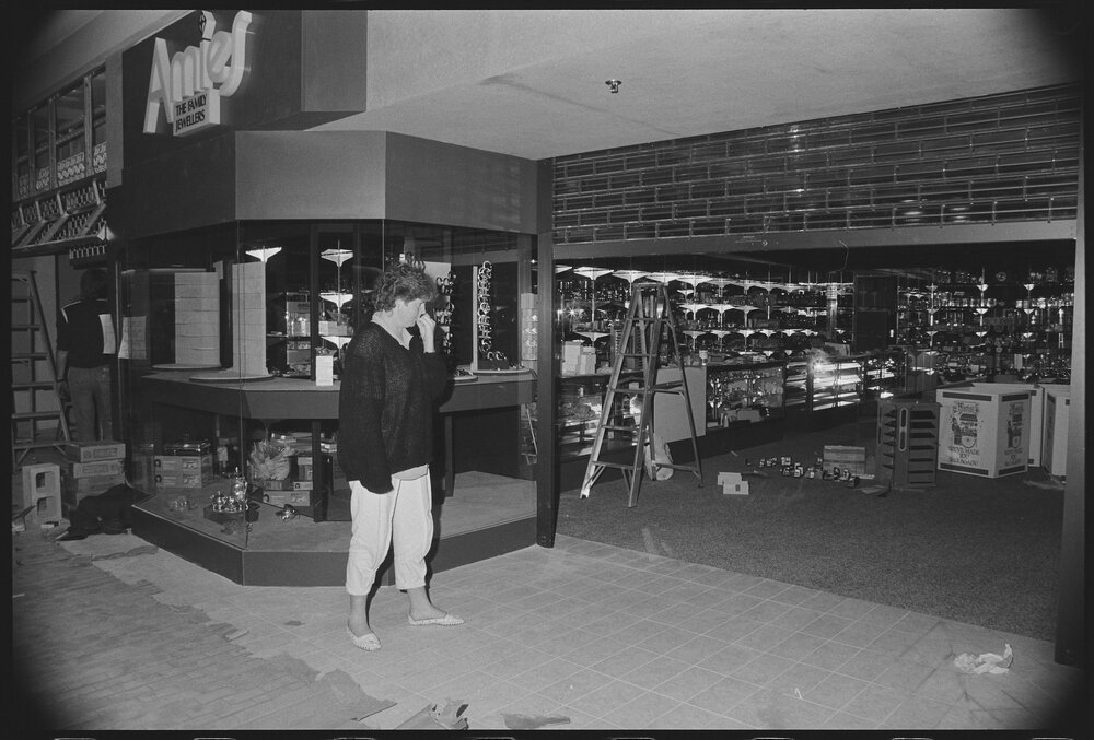 Unidentified woman outside Redbank Plaza Shopping Centre Amies Jewellers during construction, Redbank, September 1985