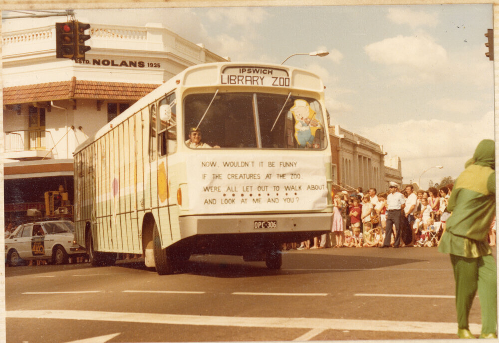 Library Bookmobile, as the "Library Zoo", in a parade, corner Nicholas and Brisbane Street, Ipswich, c.1980