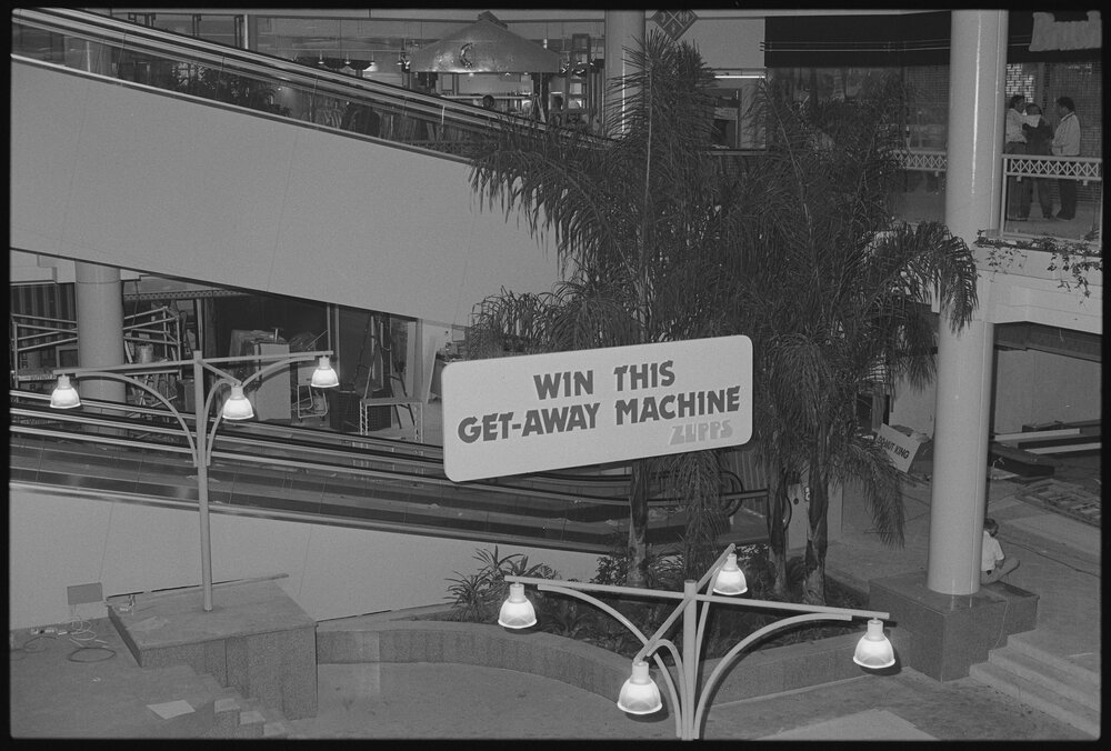Ground floor escalator of Redbank Plaza Shopping Centre during construction, Redbank, September 1985