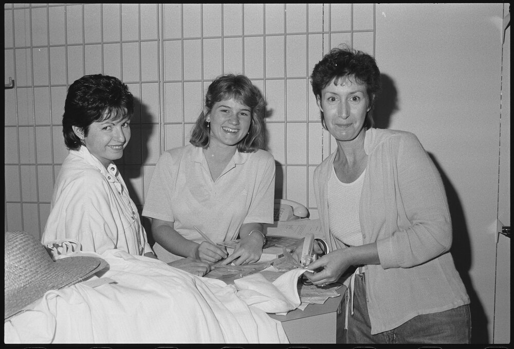 Three unidentified women working in Redbank Plaza Shopping Centre during construction, Redbank, September 1985