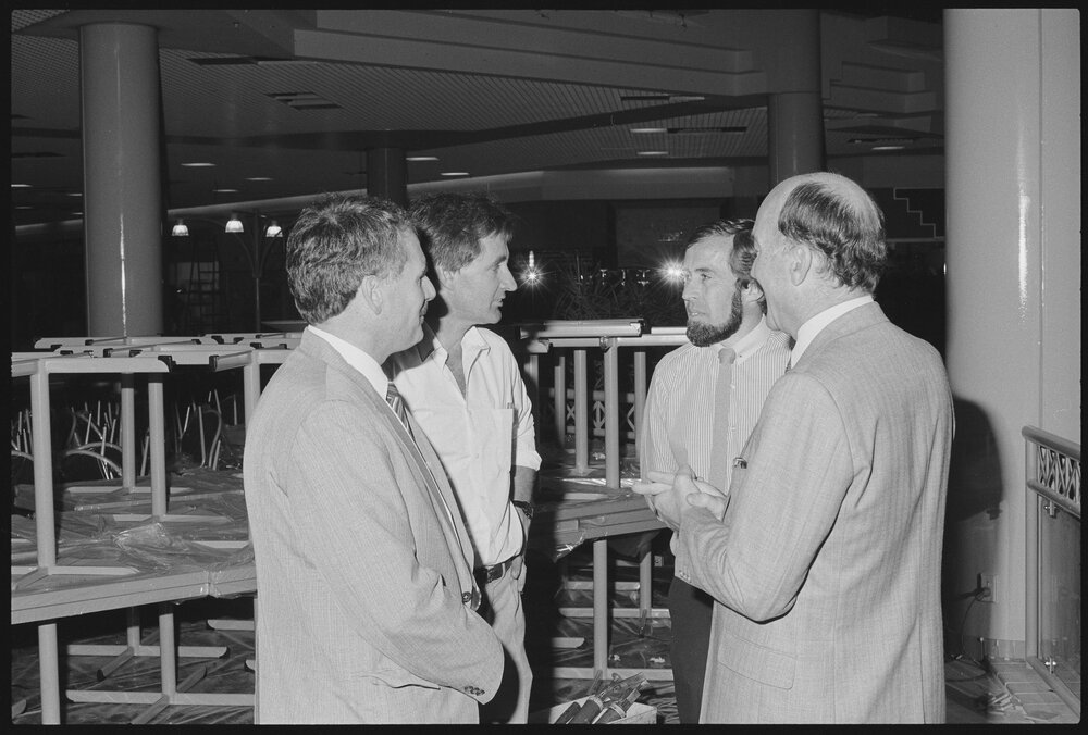 Unidentified group of men in the food court of Redbank Plaza Shopping Centre, Redbank, September 1985