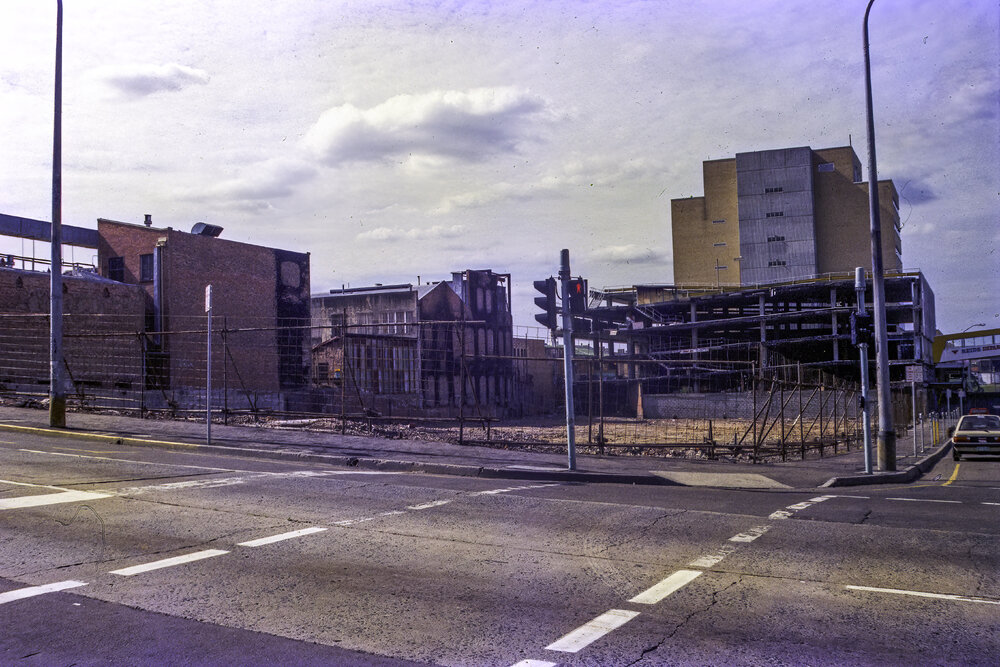 Corner of Brisbane and Bell Street, following the removal of the Reid's (Cribb &amp; Foote) Building, Ipswich, September 1985