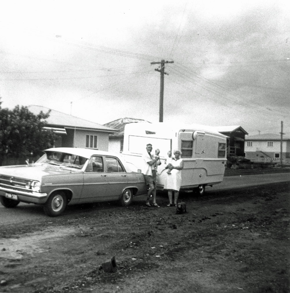 Couple in front of caravan, Booval, Ipswich, 1968