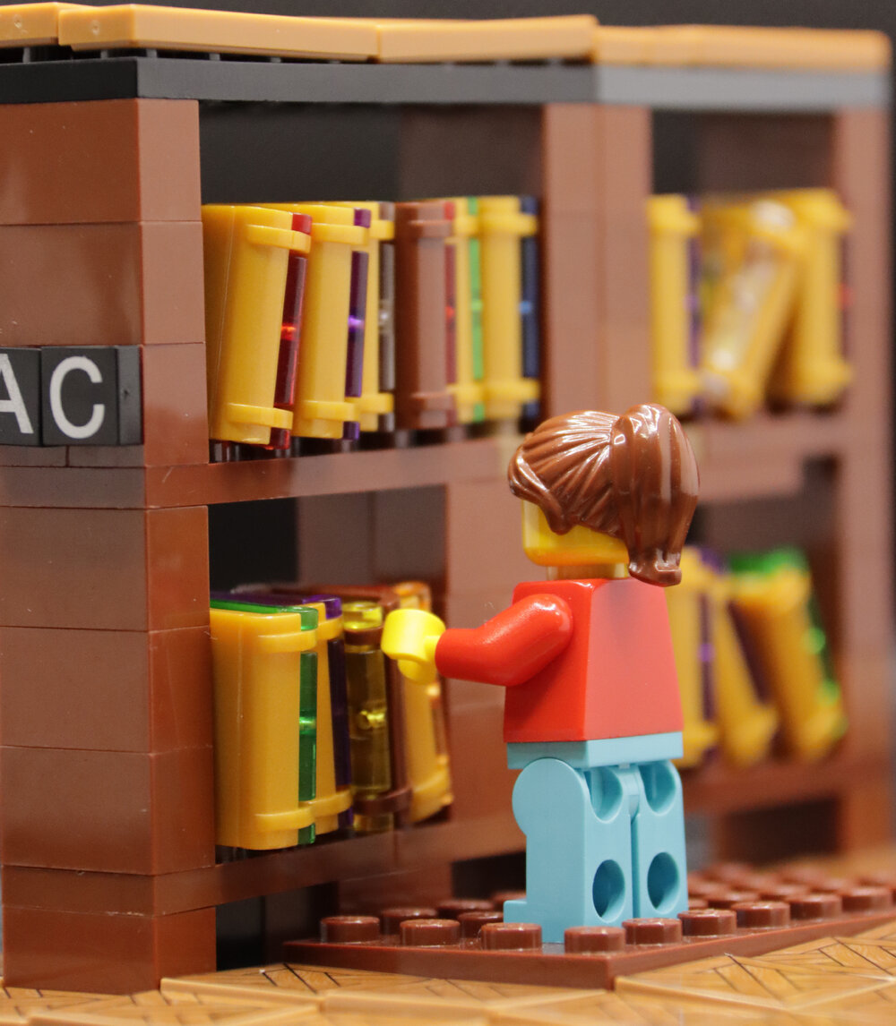 Brickswich version of Unidentified librarian working in the bookshelves, Ipswich Municipal Library, Ipswich Centre, Ipswich, Queensland, n.d.