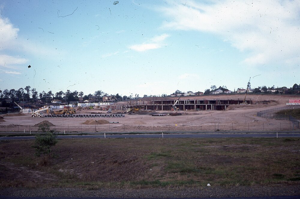 Cranes and heavy machinery constructing Redbank Plaza shopping Centre, Redbank, Ipswich, c.1985