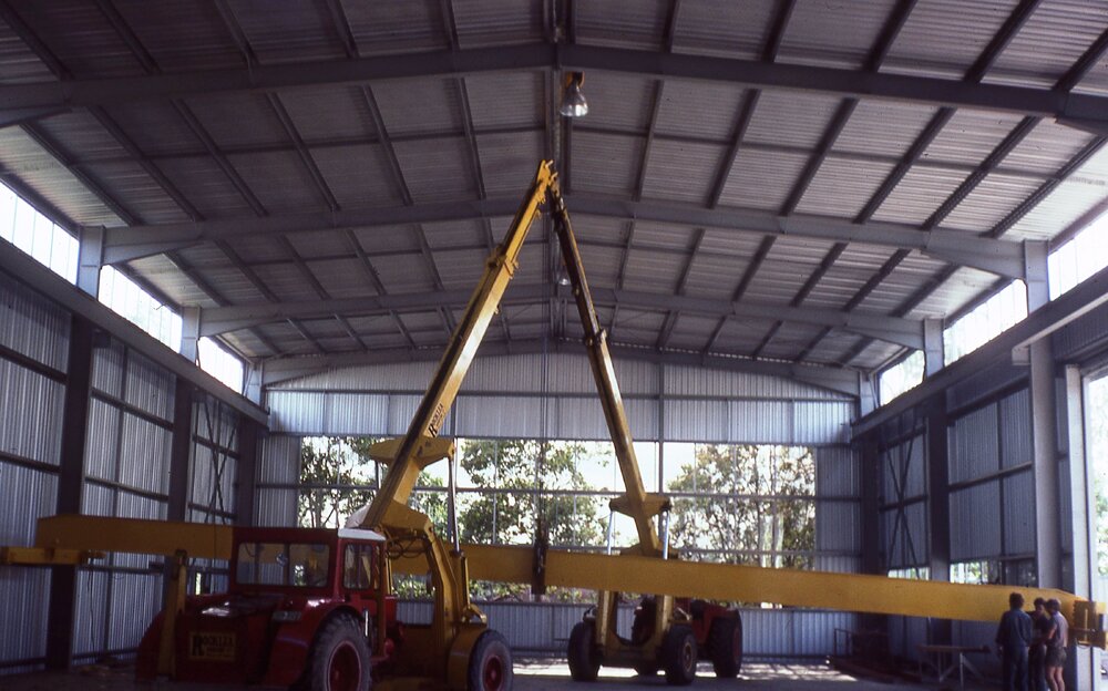 Men working inside Redbank Plaza during construction, Redbank, Ipswich, c.1985