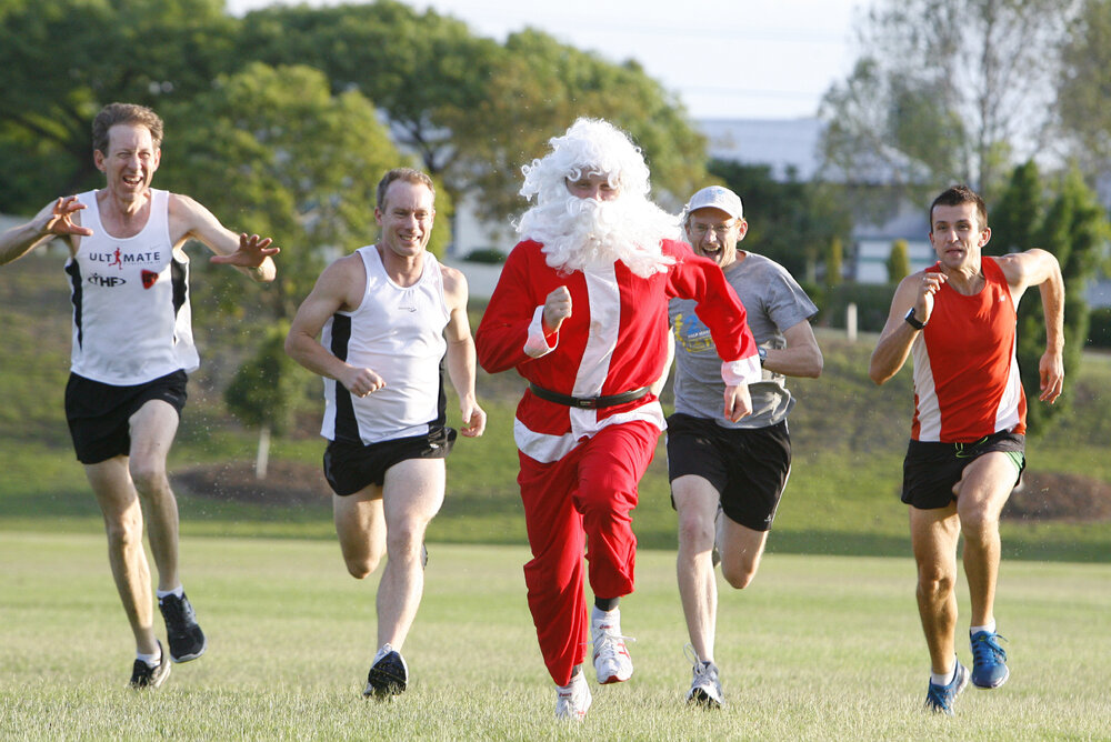 Team Ultimate Fitness (TUF) running group members in training for their annual Santa Run, Limestone Park, Ipswich, December 2011