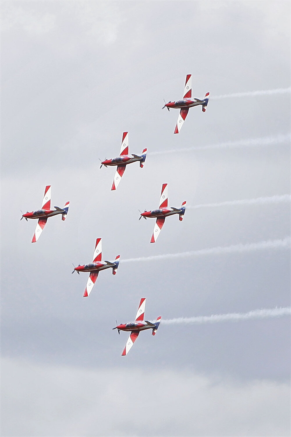 RAAF Roulettes performing aerobatic displays for Ipswich State High School students, Brassall, Ipswich, October 2011