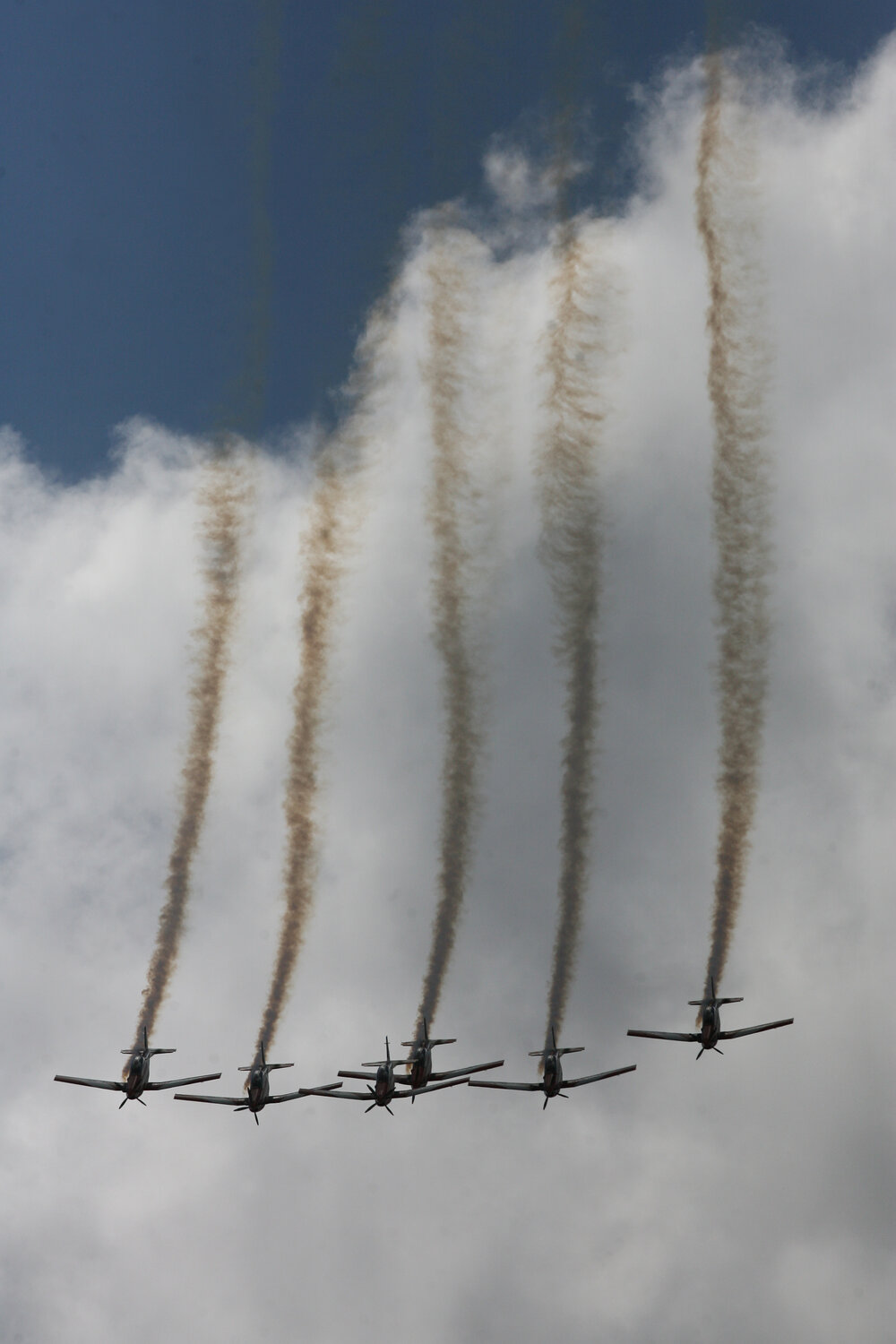 RAAF Roulettes performing aerobatic displays for Ipswich State High School students, Brassall, Ipswich, October 2011