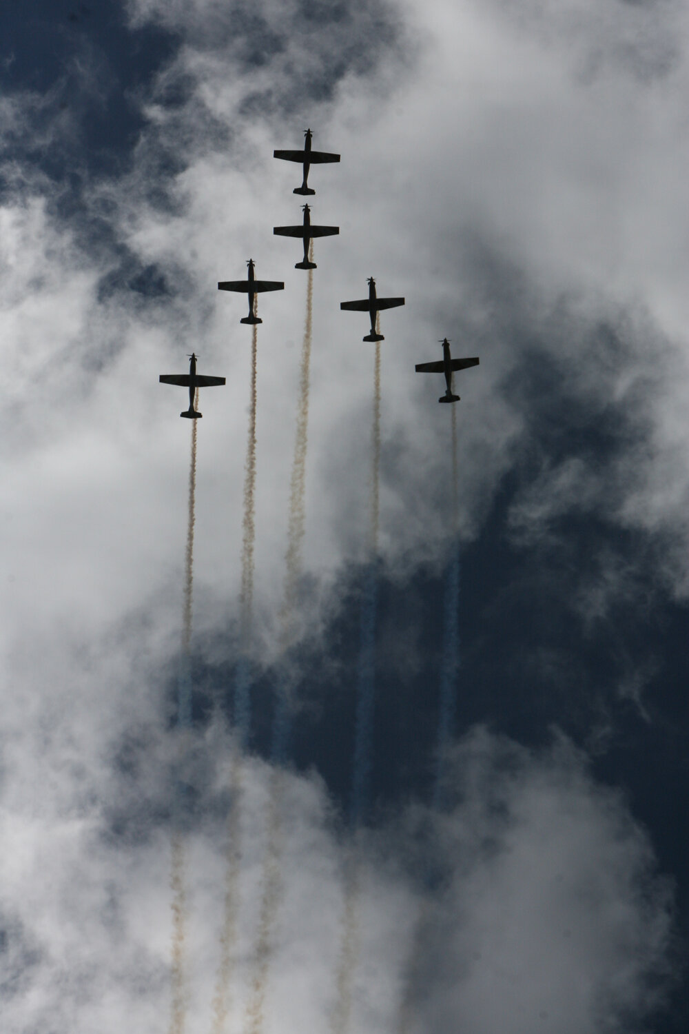 RAAF Roulettes performing aerobatic displays for Ipswich State High School students, Brassall, Ipswich, October 2011