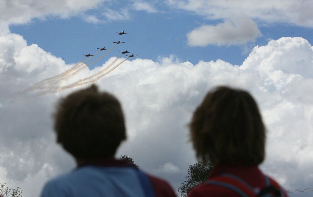 RAAF Roulettes performing aerobatic displays for Ipswich State High School students, Brassall, Ipswich, October 2011