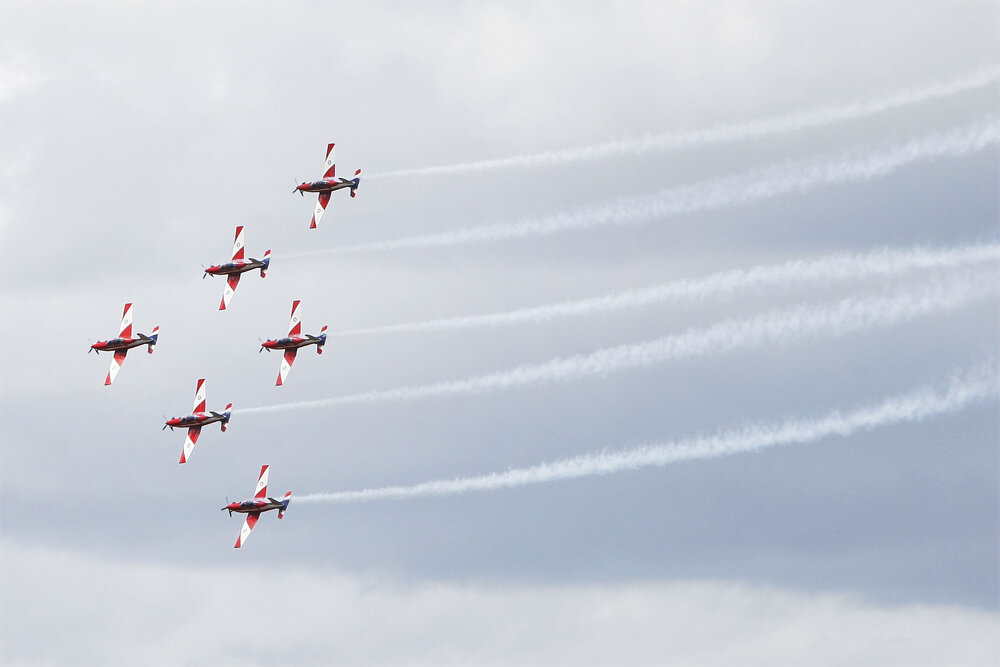 RAAF Roulettes performing aerobatic displays for Ipswich State High School students, Brassall, Ipswich, October 2011