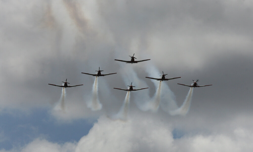 RAAF Roulettes performing aerobatic displays for Ipswich State High School students, Brassall, Ipswich, October 2011