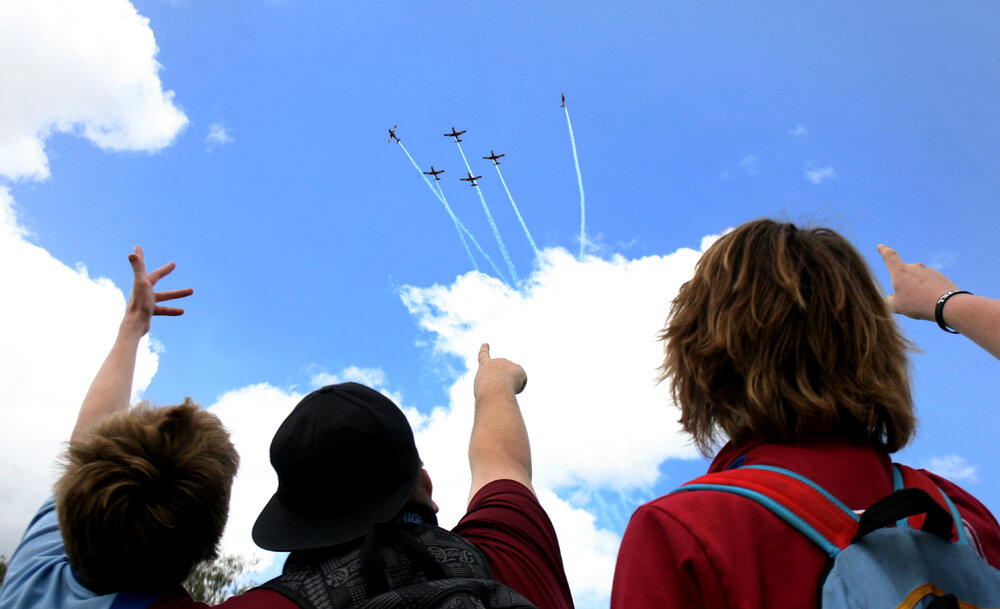 RAAF Roulettes performing aerobatic displays for Ipswich State High School students, Brassall, Ipswich, October 2011