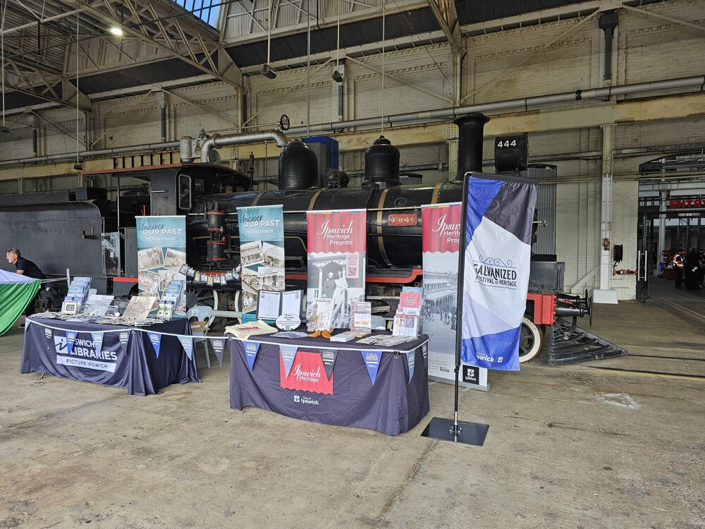 Picture Ipswich and Ipswich Heritage Program tables at the Steam, Smoke &amp; BBQ event for Galvanized, The Workshops Rail Museum, North Ipswich, September 2025