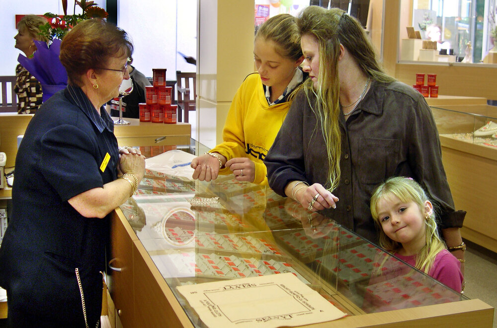 Dee Larson (staff), and Kara, Jenny, and Kori Blackwell at a jewelry store at Forest Lake Village, Ipswich, June 2004
