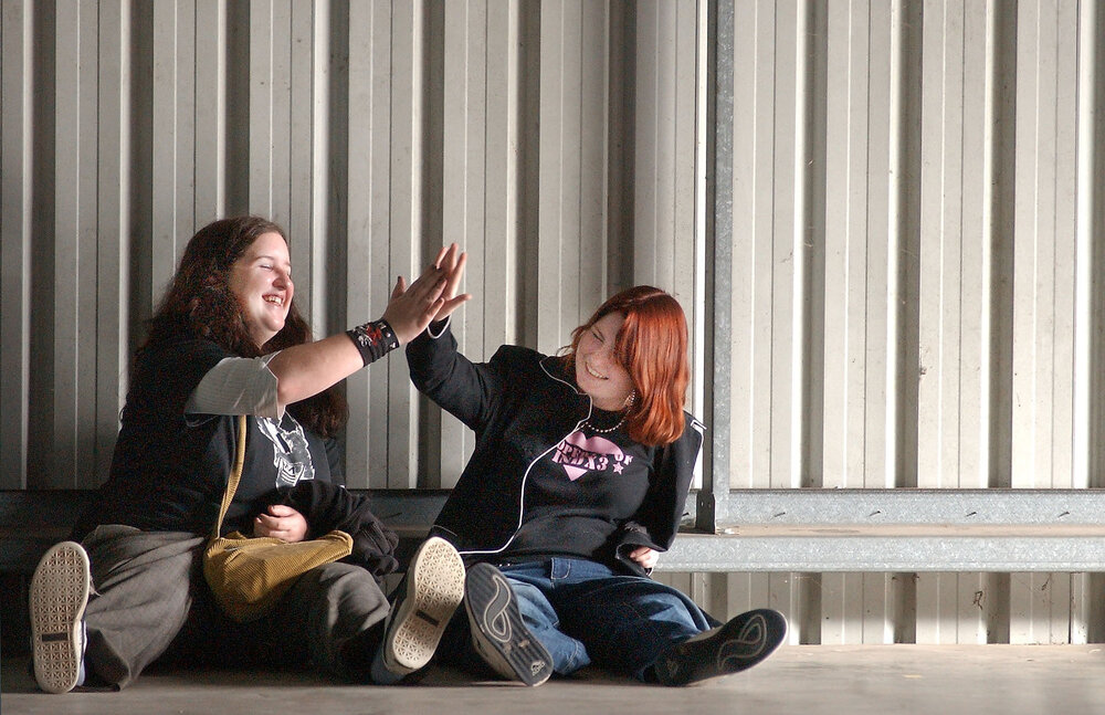 Jessie MacDonald and Erin Chilcott, and Trent Chandler, Corey Davies and Mitchell Mansfield discussing the talent at the 2004 Ipswich Battle of the Bands, Ipswich, July 2004