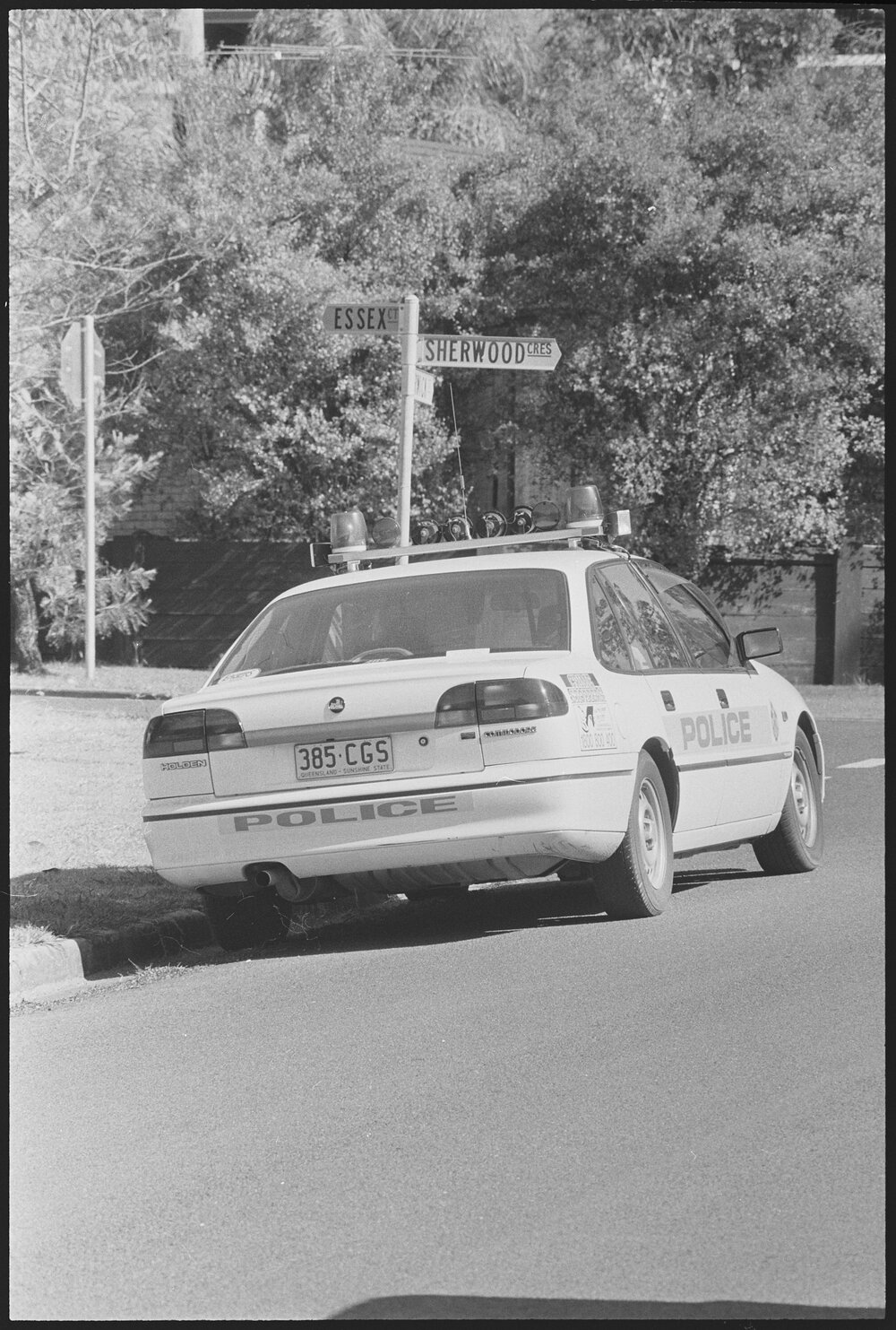 Police vehicle parked on the corner of Essex Court, Warwick Court, and Sherwood Crescent, Bellbird Park, Ipswich, 1st August 1994