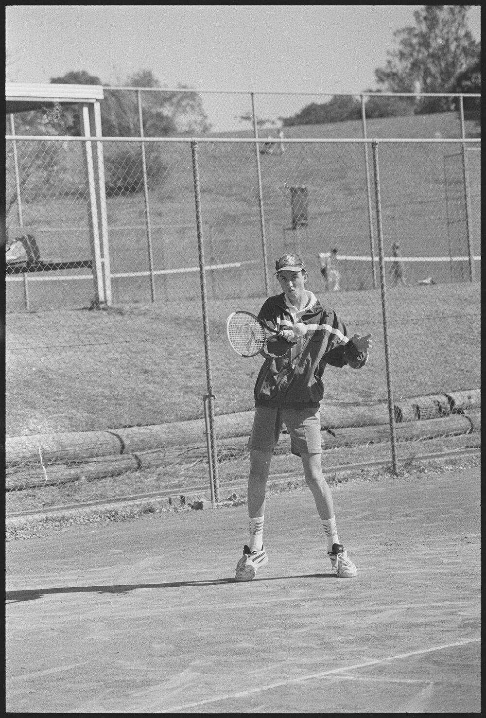 Unidentified teenage boy playing tennis, location unknown, 1st August 1994