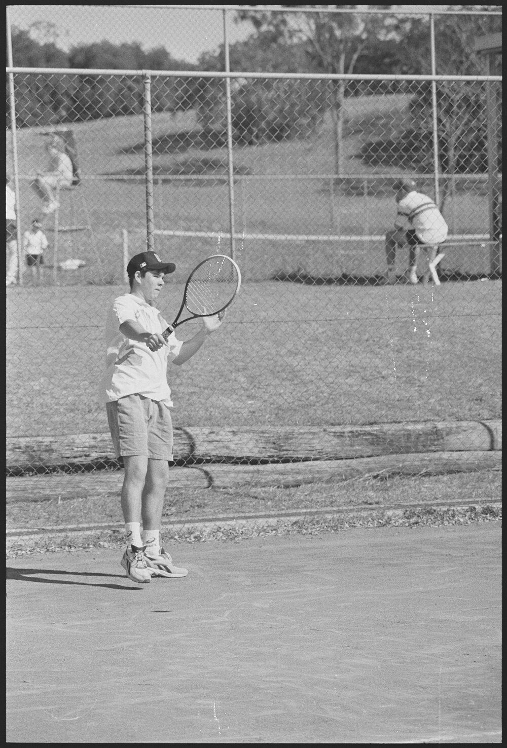 Unidentified teenage boy playing tennis, location unknown, 1st August 1994