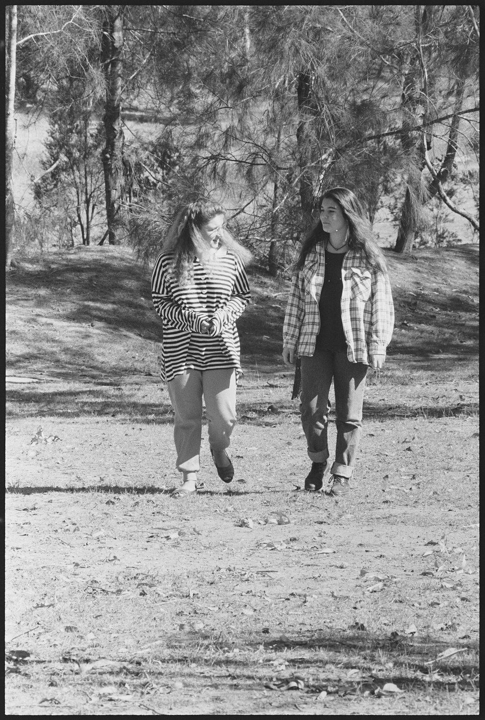 Two unidentified young women walking, location unknown, 1st August 1994