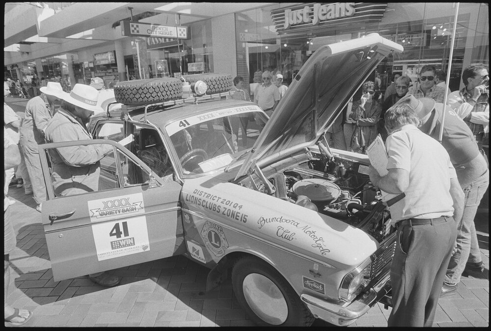 Men inspecting one of the vehicle entries in the Variety Bash, Nicholas Street Mall, Ipswich, 4th August 1994