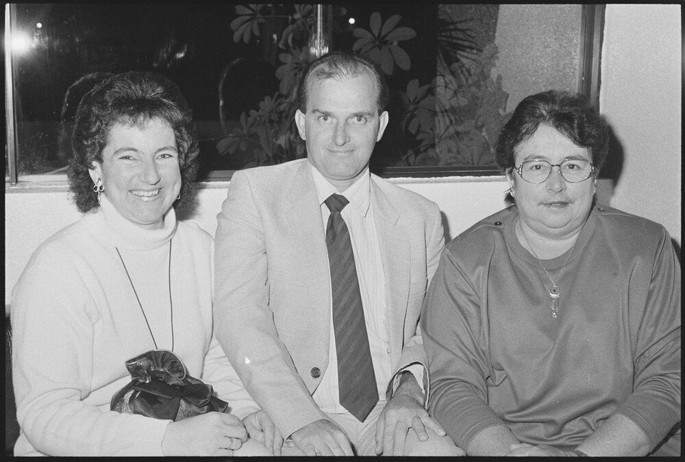 Unidentified group sitting in the foyer of the Ipswich Civic Centre, Ipswich, August 1994