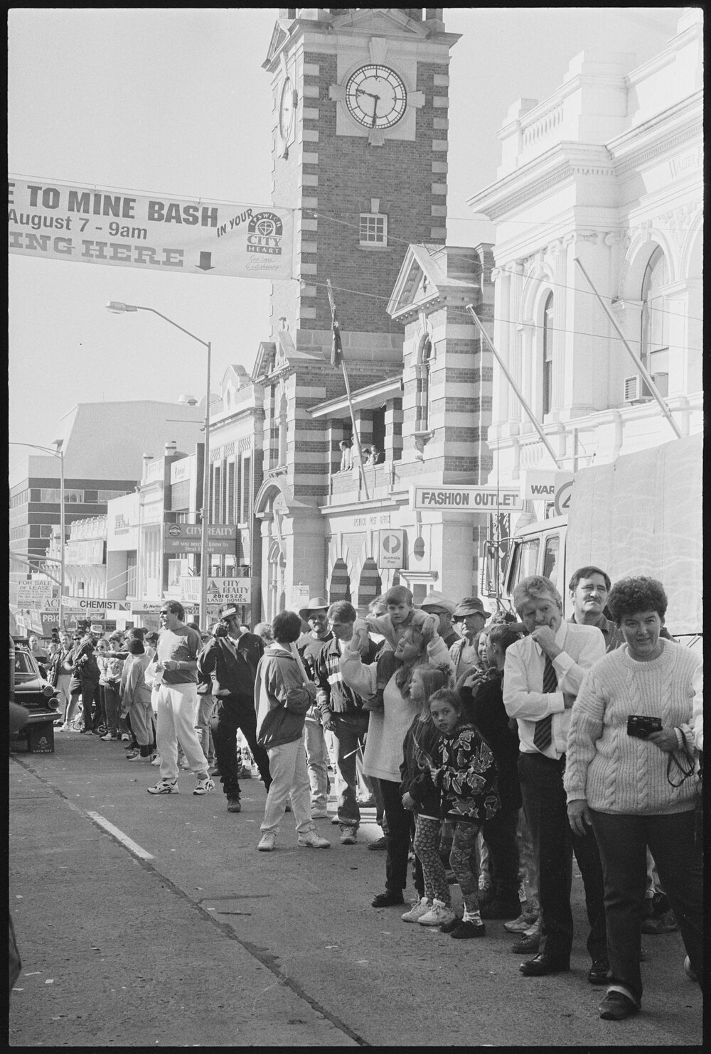 Crowd watching Variety Bash vehicles drive down Brisbane Street, Ipswich, 5th August 1994