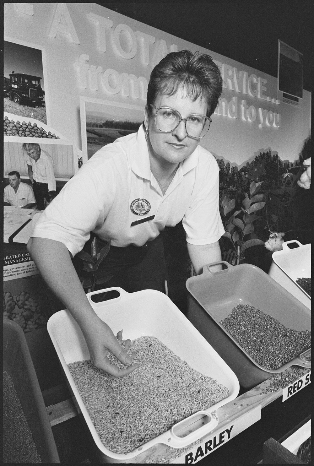 Queensland Forest Service representative Karen demonstrating at an education booth at the Ekka, Brisbane Showgrounds, Brisbane, 18th August 1994