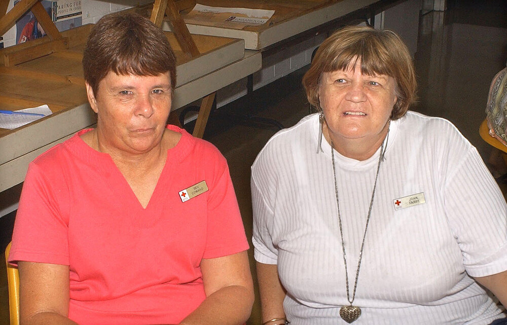 Ipswich Red Cross members Bev Coward and Joan Saxby with June Smith at their morning tea in aid of the Asian tsunami victims, Ipswich, 12th January 2005 