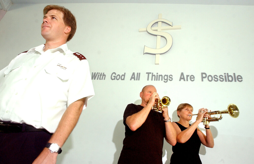 Captain Steve Briggs, Koss Siwers and Di Jeffrey pf the Salvation Army holding a benefit concert to raise money for the victims of the Tsunami disaster, Ipswich, 20th January 2005 