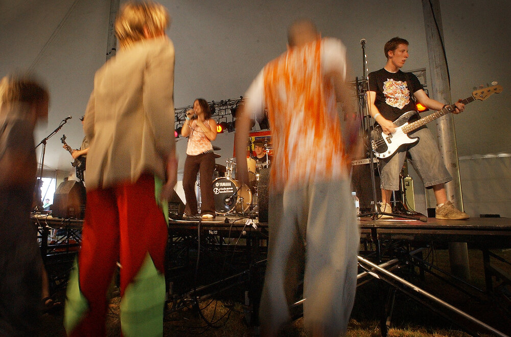Fans dressed in their Sunday finest jumping around to the Christian band Ripple Effect's lyrics about praising the lord and loving Jesus, Ipswich, 20th January 2005