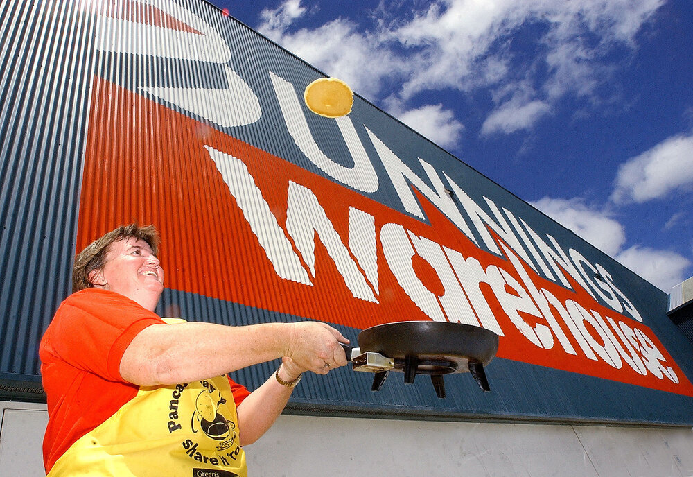Bernee Smee flipping a pancake for the pancake fundraiser at Bunnings Warehouse, Ipswich, 31st January 2005