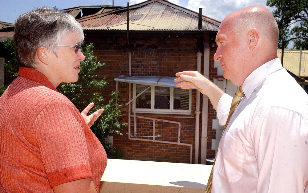 District manager Pam Lane shows the Minister of Health Gordon Nuttall, the destruction caused by the fire at the Ipswich hospital, Ipswich, 8th February 2005