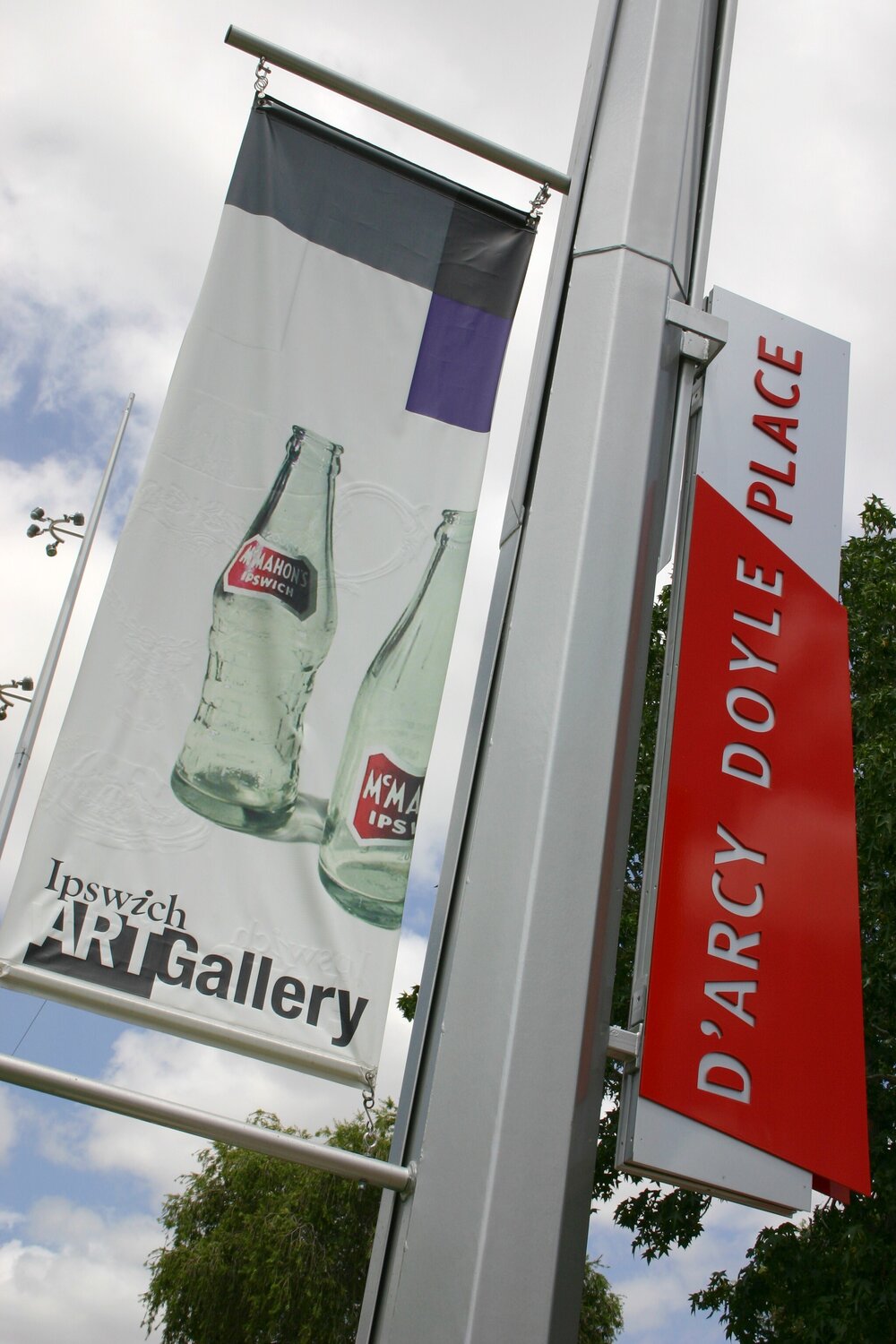 Ipswich Art Gallery signage, featuring McMahon's bottles, in d'Arcy Doyle Place, Ipswich, February 2006