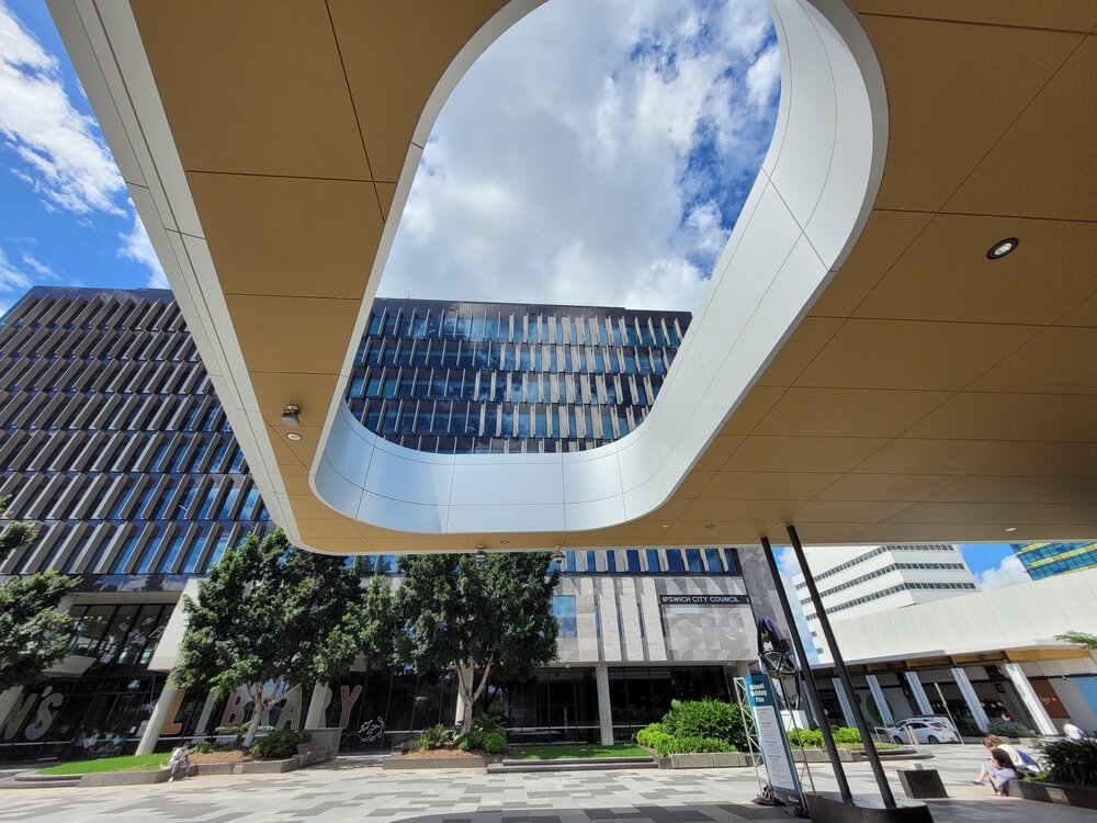 View of the Council Administration building, through the awning of Ipswich Central Library, Tulmur Place, Ipswich, March 2024