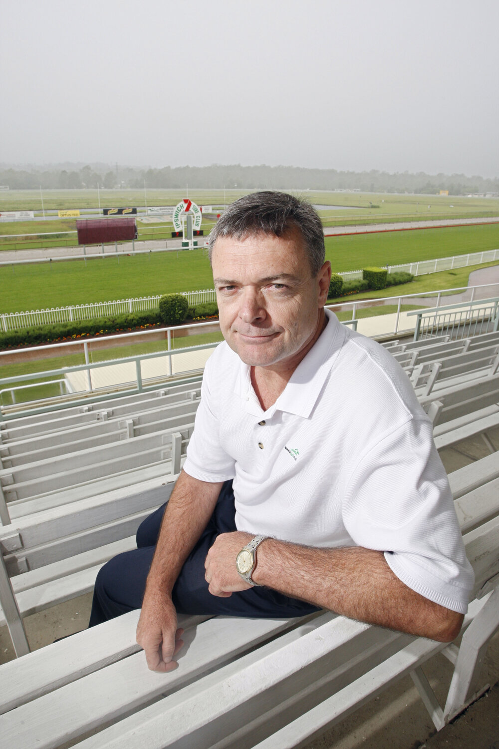 Brett Kitching from the Ipswich Turf Club overlooking a wet track caused by the recent rainfall, Ipswich, 6th January 2011