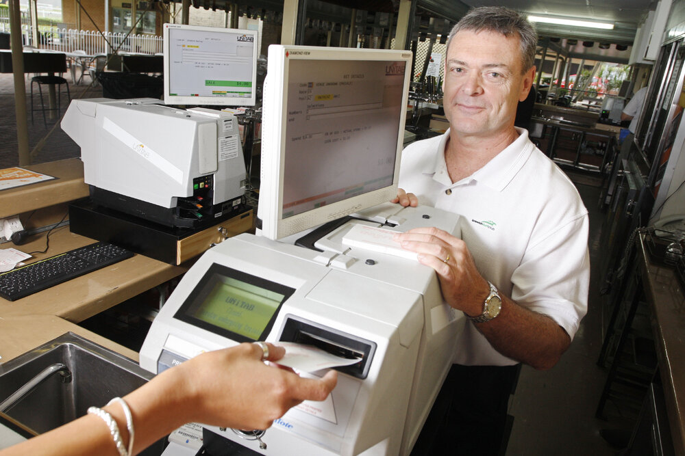 Brett Kitching from the Ipswich Turf Club with the new TAB machines which are the first in Queensland, Ipswich, 6th January 2011 