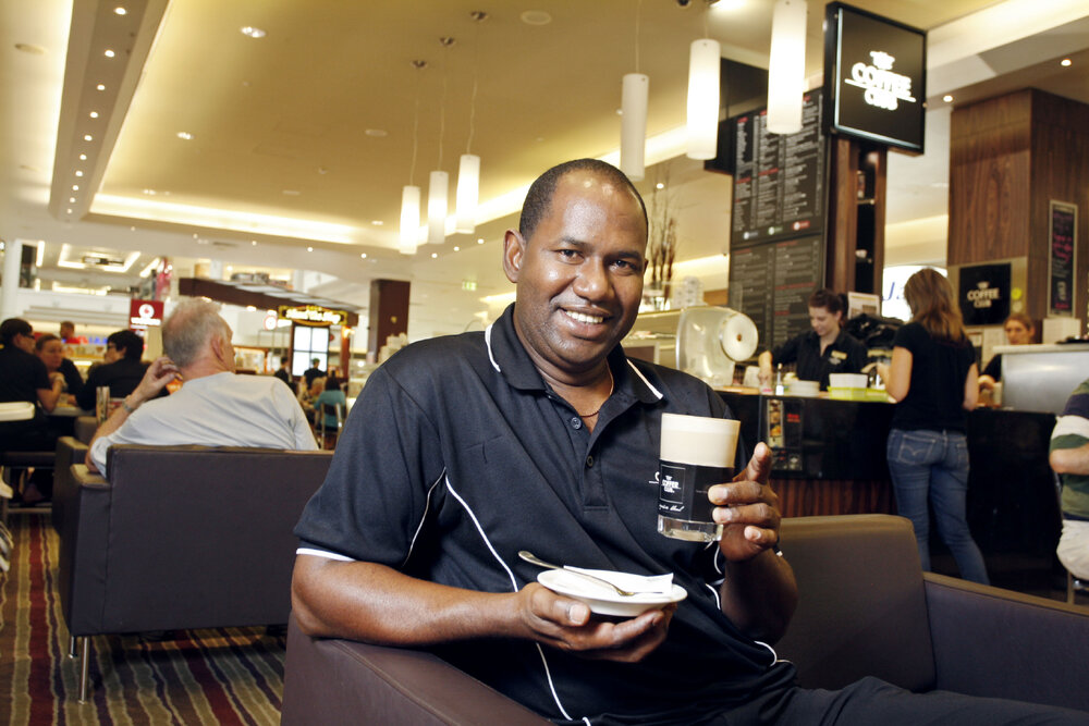 Redbank Plaza Coffee Club franchisee Boubacar Barry will be donating money spent on coffees on Wednesday to the flood victims, Ipswich, 10th January 2011 