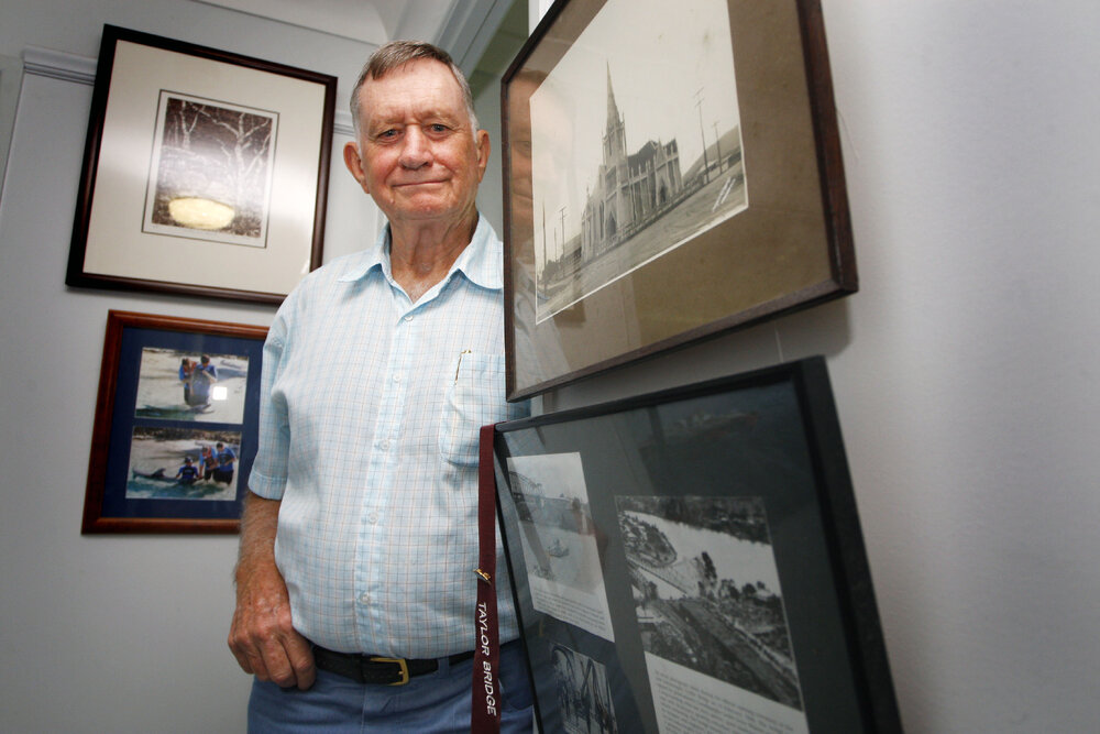 Noel Davis of Raceview beside photographs of buildings and structures built by his grandfather Walter Taylor, Ipswich, 21st January 2011 