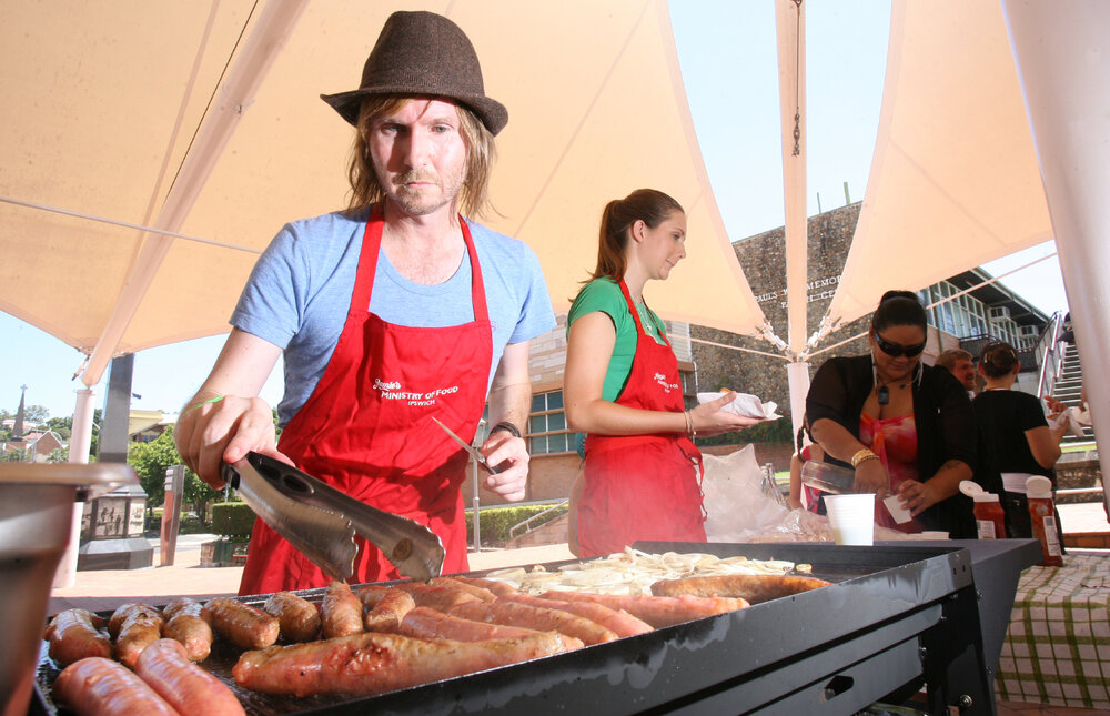 Druce Davey and Charlotte Rashleigh from Jamie's ministry of Food prepare a free Australia Day barbeque for Ipswich residents in Darcy Doyle Place, Ipswich, 26th January 2011 