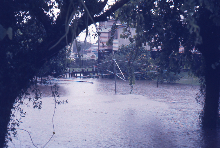 Flood waters entering a backyard at Pelican Street, from Flint Street, North Ipswich, 3pm, 26th January 1974