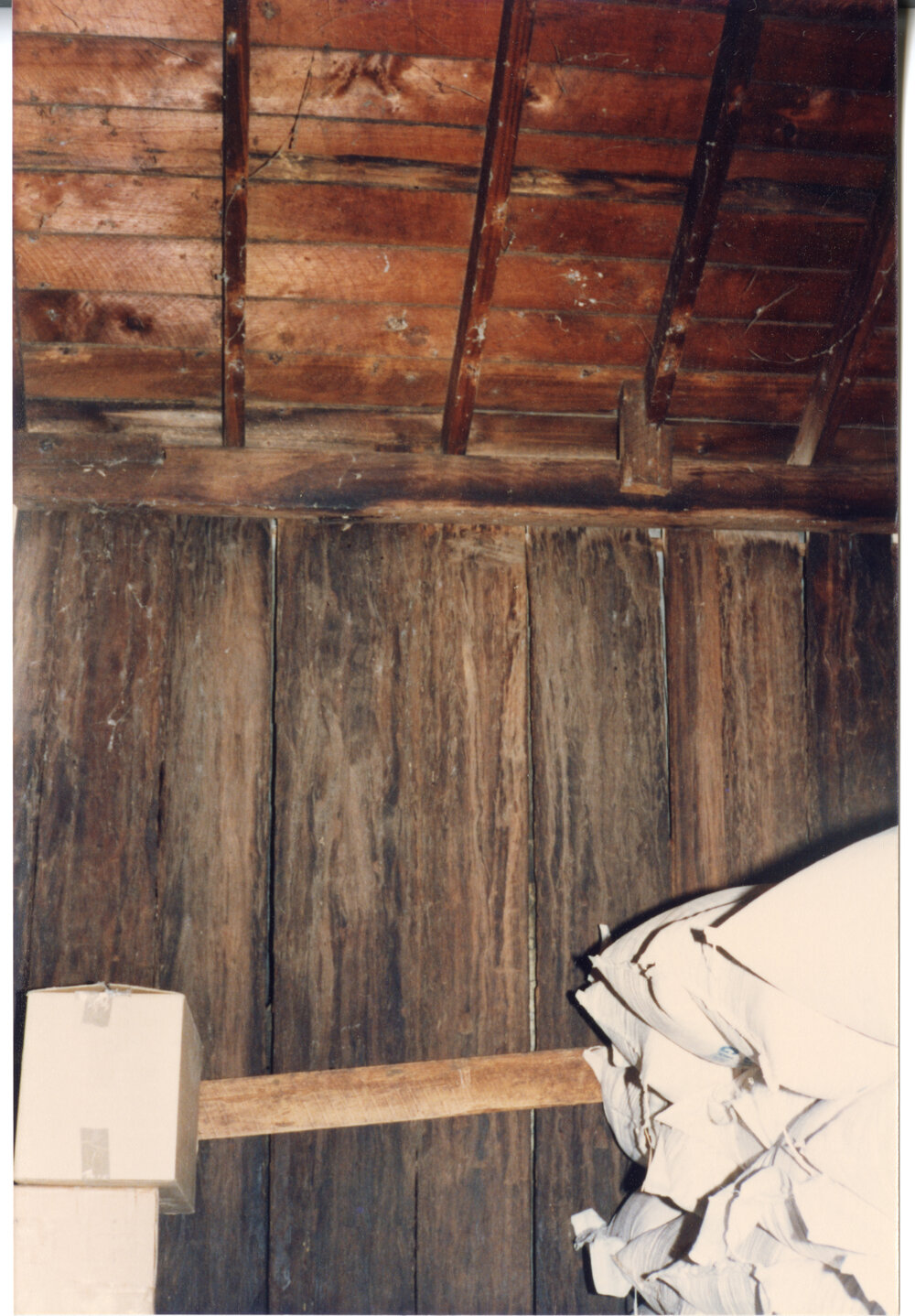 Wide timber boards and bags of stock in Risson's Produce