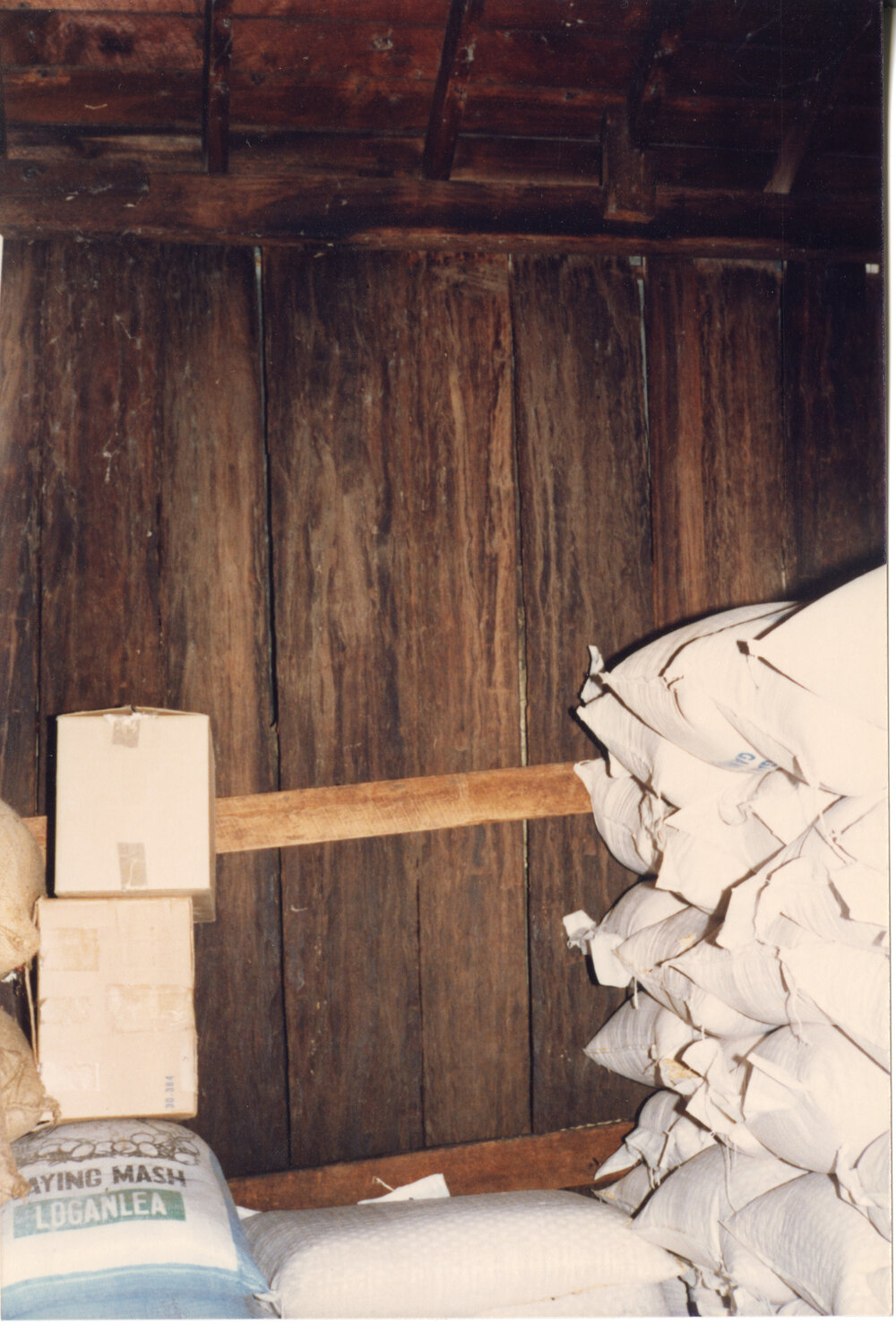 Wide timber boards and bags of stock in Risson's Produce