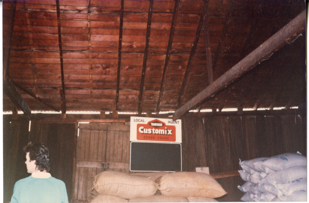 Wide timber boards and bags of stock inside Risson's Produce
