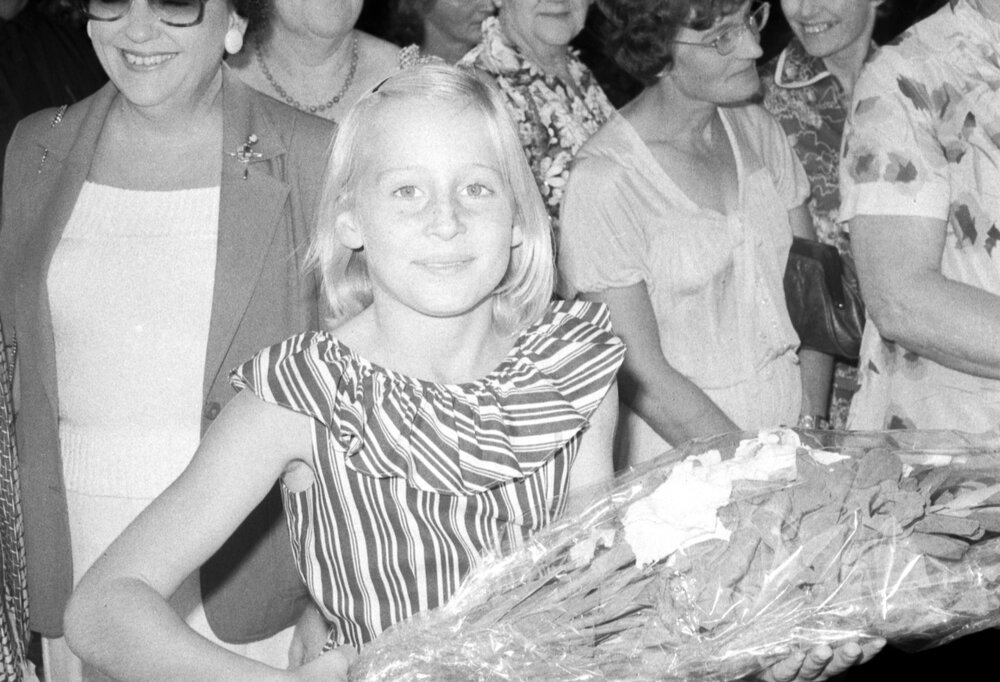 Unidentified girl with bouquet at the the memorial in honour of Mary Aileen Bell, Coochin Coochin, Scenic Rim, April 1980