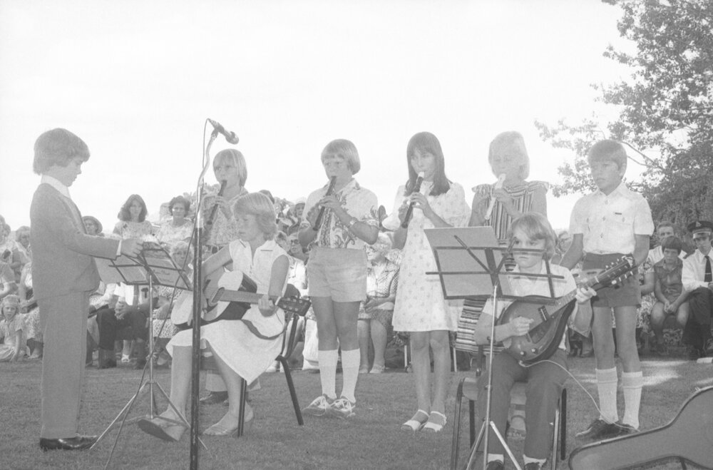 Unidentified children playing music at the the memorial in honour of Mary Aileen Bell, Coochin Coochin, Scenic Rim, April 1980